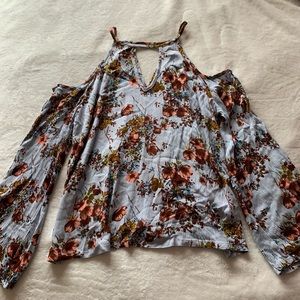 Open shoulder long sleeve blouse.